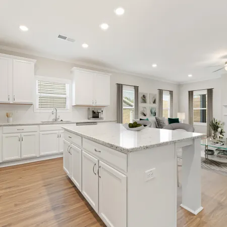 a kitchen with white cabinets