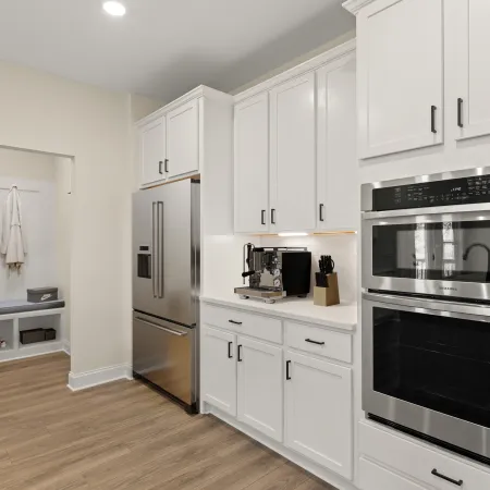 a kitchen with white cabinets
