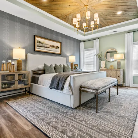 a bedroom with a bed and a bench