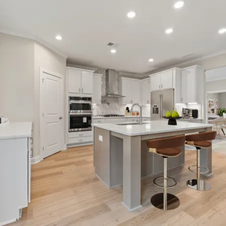 a kitchen with white cabinets
