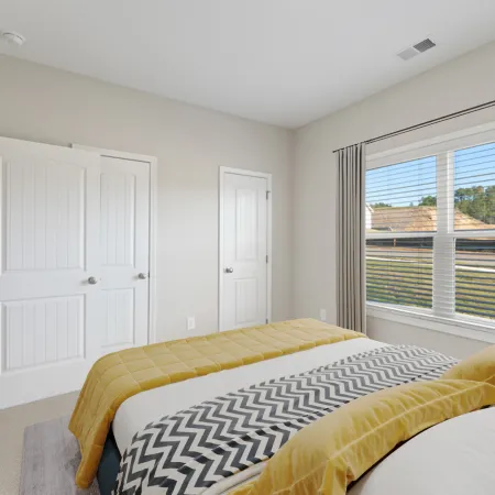 a bedroom with a large window