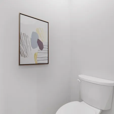 Minimalist white bathroom corner with a framed abstract artwork and a closed white toilet on wood floor.