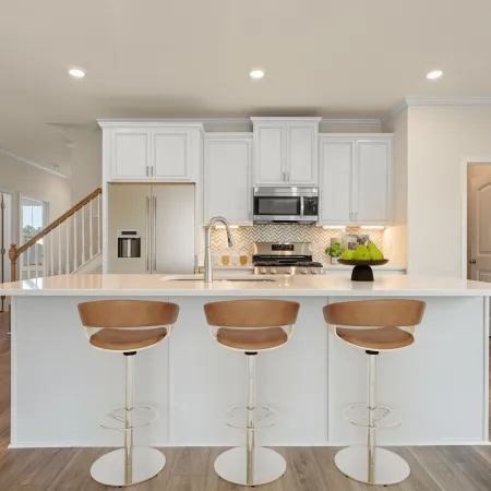 a kitchen with white cabinets