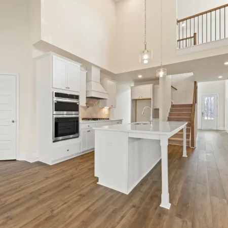 a kitchen with white cabinets