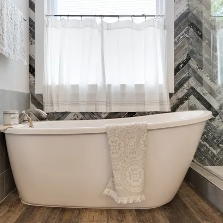 a large tub next to a sink