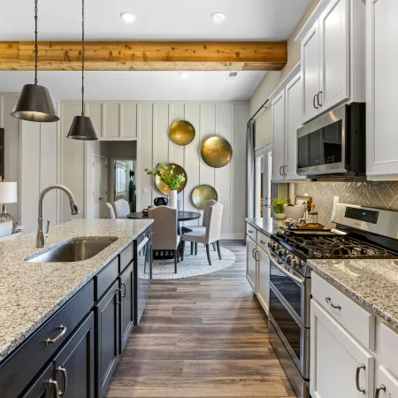 a kitchen with a stove and oven