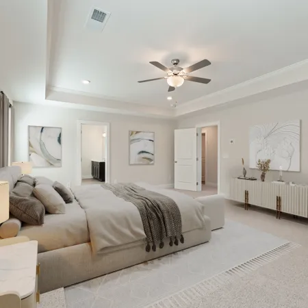 a bedroom with a bed and a fan
