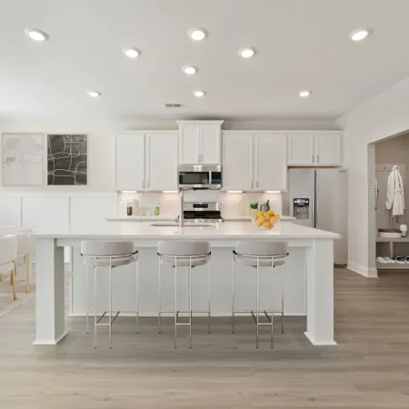 a kitchen with white cabinets