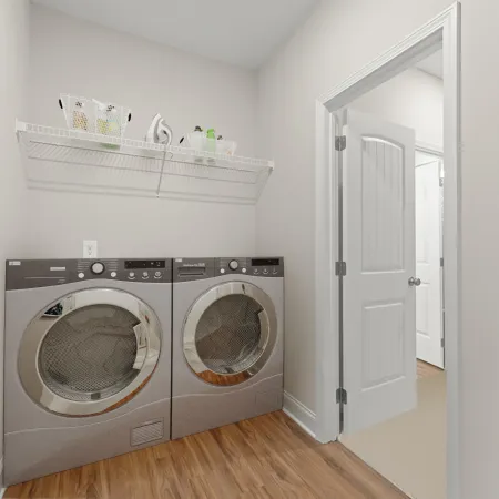 a room with a washing machine and a door
