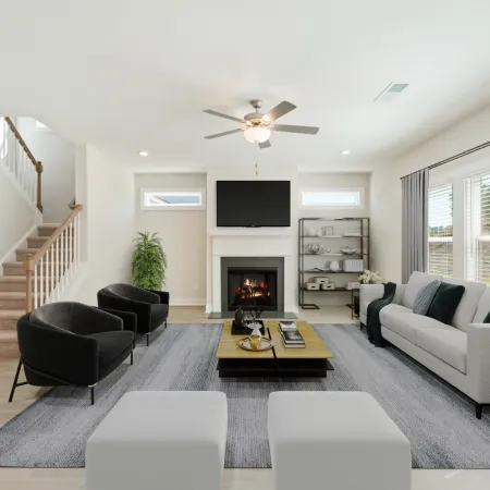 a living room with a fireplace and a couch