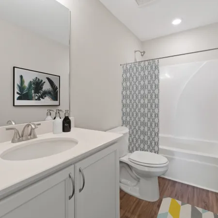 a bathroom with a tub sink and toilet