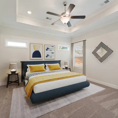 a bedroom with a bed and a fan