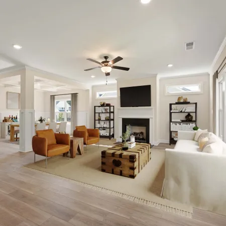 a living room with a large white couch and a wood floor