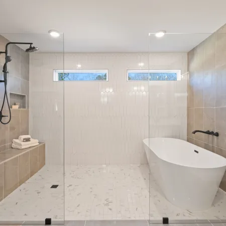 a bathroom with a bathtub and toilet