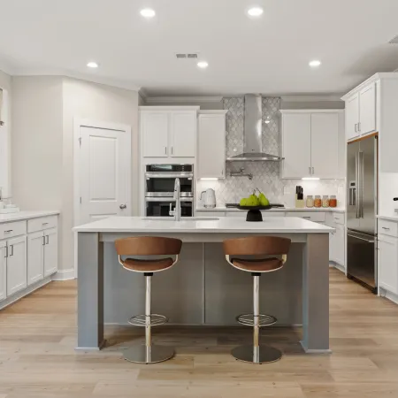 a kitchen with white cabinets