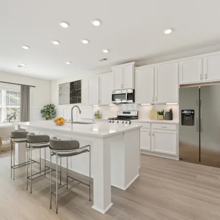 a kitchen with white cabinets