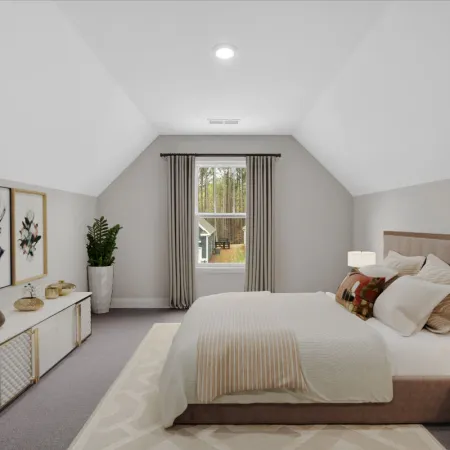 Cozy modern bedroom with plush bedding, artwork, and natural light from a window.