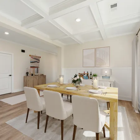 a dining room with white chairs