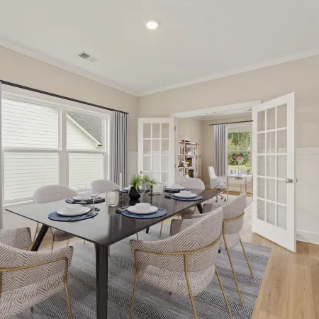 a dining room table with chairs