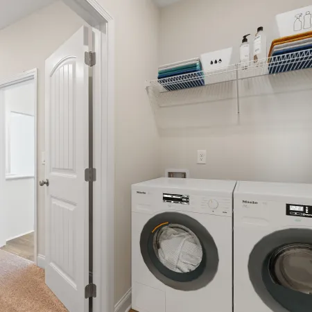 a laundry room with a washer and dryer