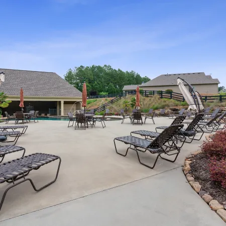 a patio with chairs and tables