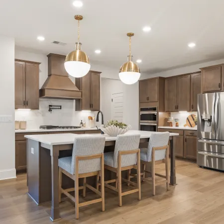 a kitchen with a dining table and chairs