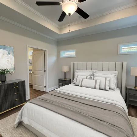 a bedroom with a bed and a fan