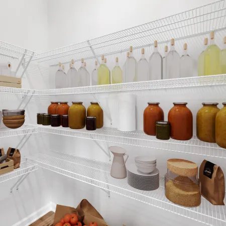 Organized pantry shelves with jars, fruits, and kitchenware, showcasing storage ideas and design.