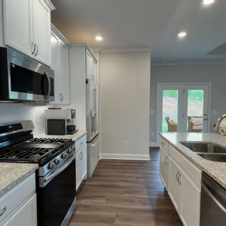 a kitchen with a stove and a sink