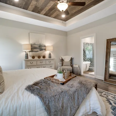 a bedroom with a bed and a fireplace