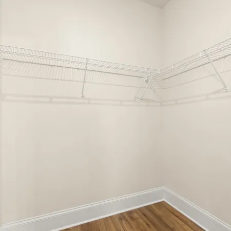 a white wall with a vent