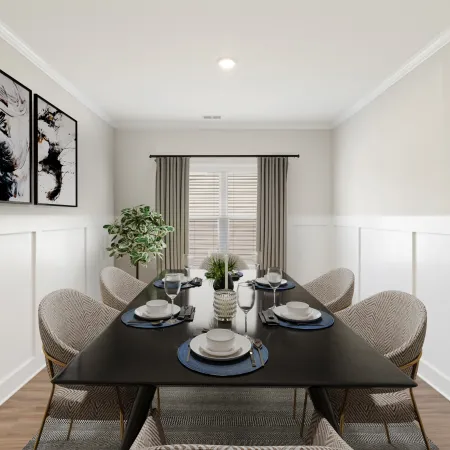 a dining room table with a plant on it
