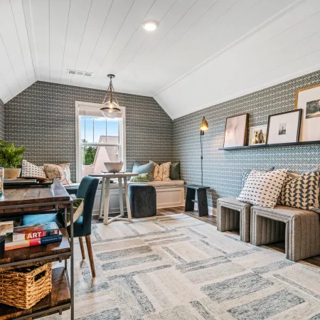 a room with a couch and a table with a basket and a basket