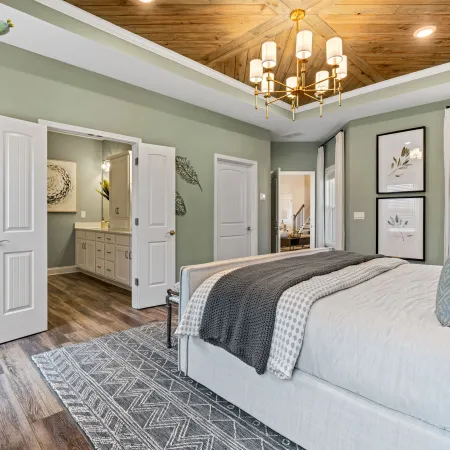 a bedroom with a bed and a couch