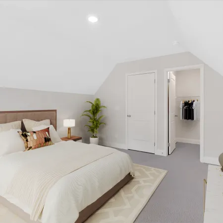 Modern bedroom with a cozy bed, stylish decor, and a closet in a minimalist design.