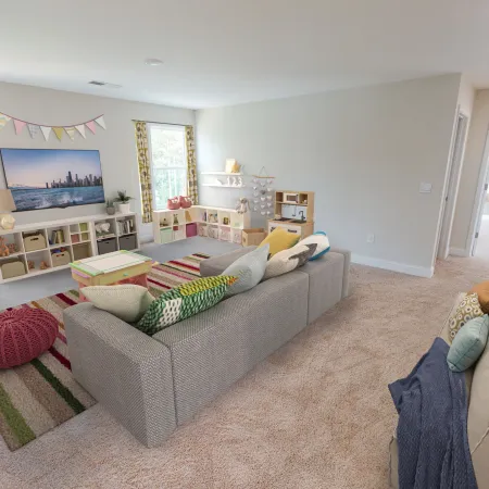 a living room filled with furniture and a flat screen tv