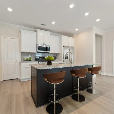 a kitchen with white cabinets