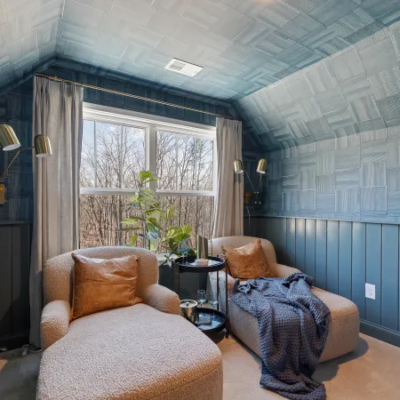 a room with a couch and a chair