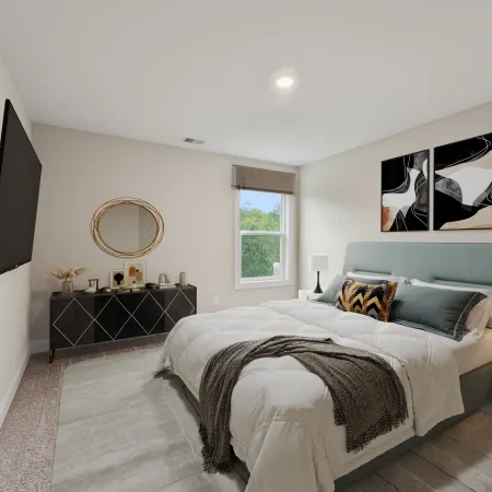 a bedroom with a bed and a mirror