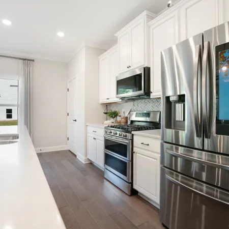 a modern kitchen with stainless steel appliances
