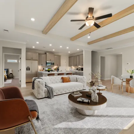 a living room with a large chandelier and a couch