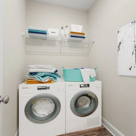 a washing machine and dryer in a room