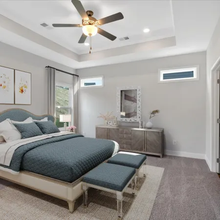 Modern bedroom with a queen bed, blue bedding, twin benches, dresser, and ceiling fan with light.