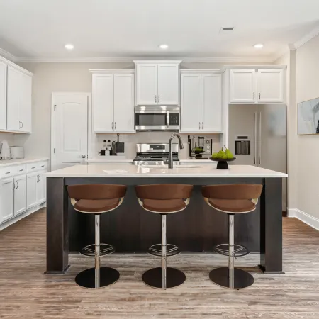 a kitchen with white cabinets
