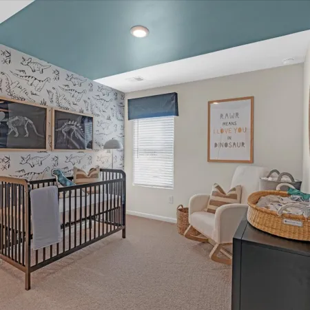 a room with a crib and a crib