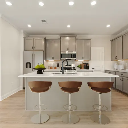 a kitchen with stools and a table