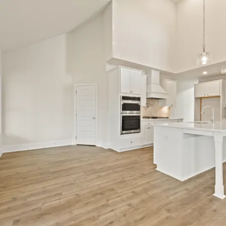 a kitchen with white cabinets