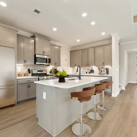 a kitchen with white cabinets