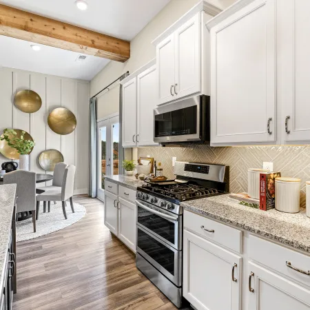 a kitchen with white cabinets