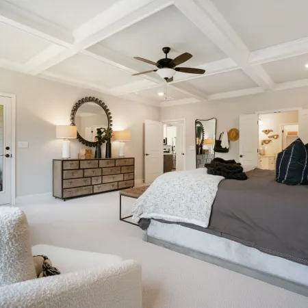 a bedroom with a large bed in a room
